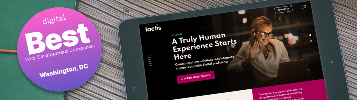 An ipad with Tactis homepage displayed on it, sitting on a table and an award badge overlaid on top