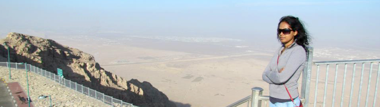 Banner image of Rebecca Rodrigues visiting desert mountain overlook