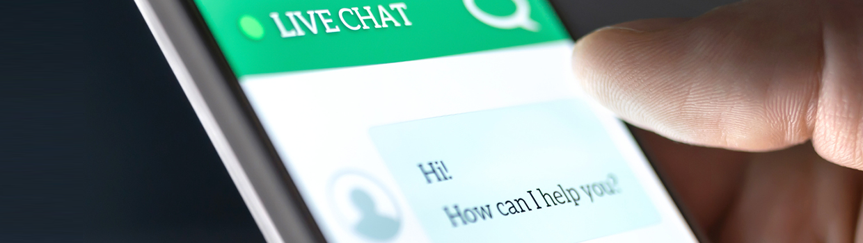 blog banner image showing a mobile phone with a chat bot conversationn